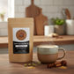 Steaming cup of bold and spicy Indian Masala Chai with milk and aromatic spices