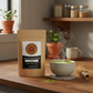 Ceremonial matcha powder vibrant green fine texture in bowl with bamboo whisk