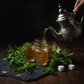 Moroccan Mint tea with fresh mint leaves and green tea blend in a glass cup